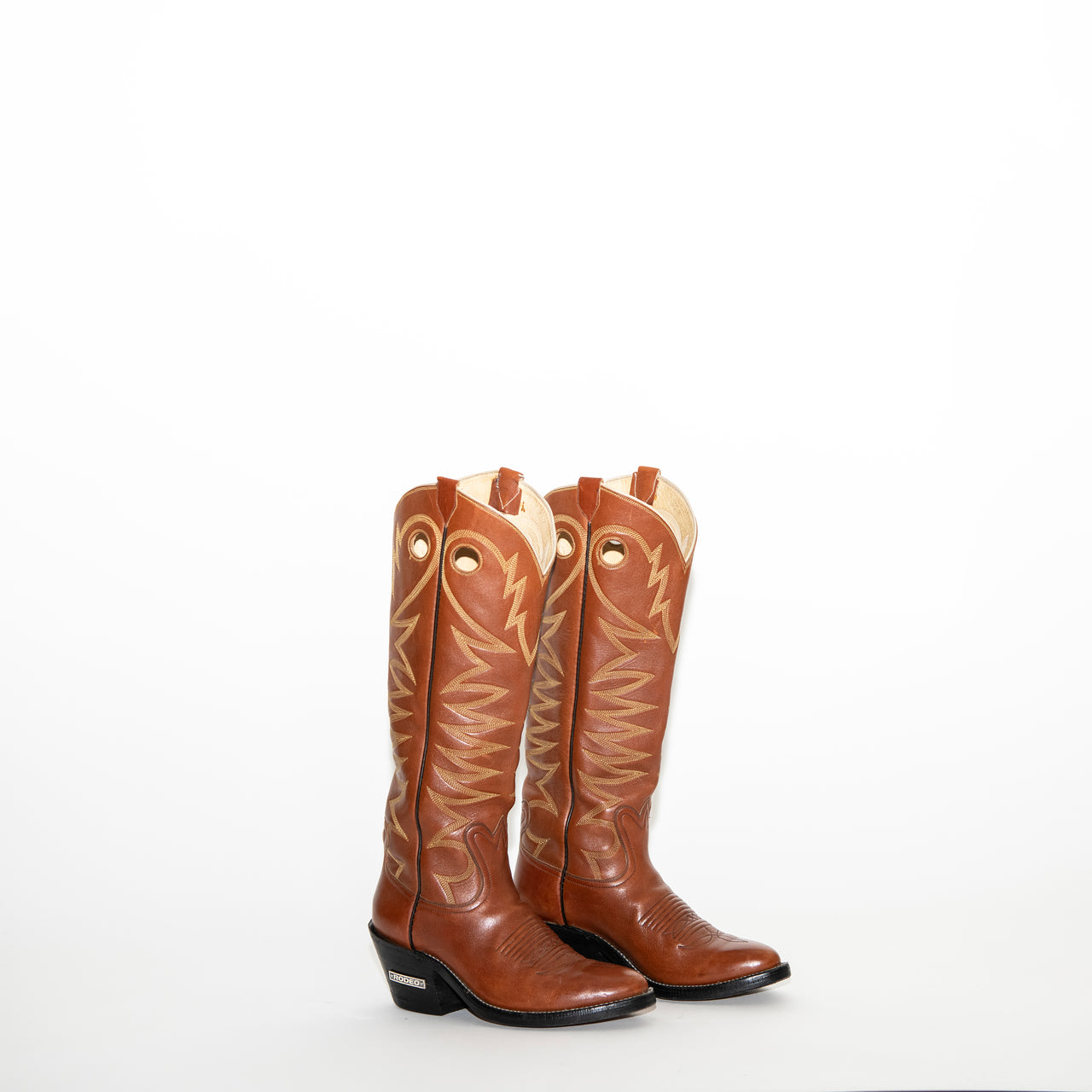 cinnamon fire-stiched knee-high boot